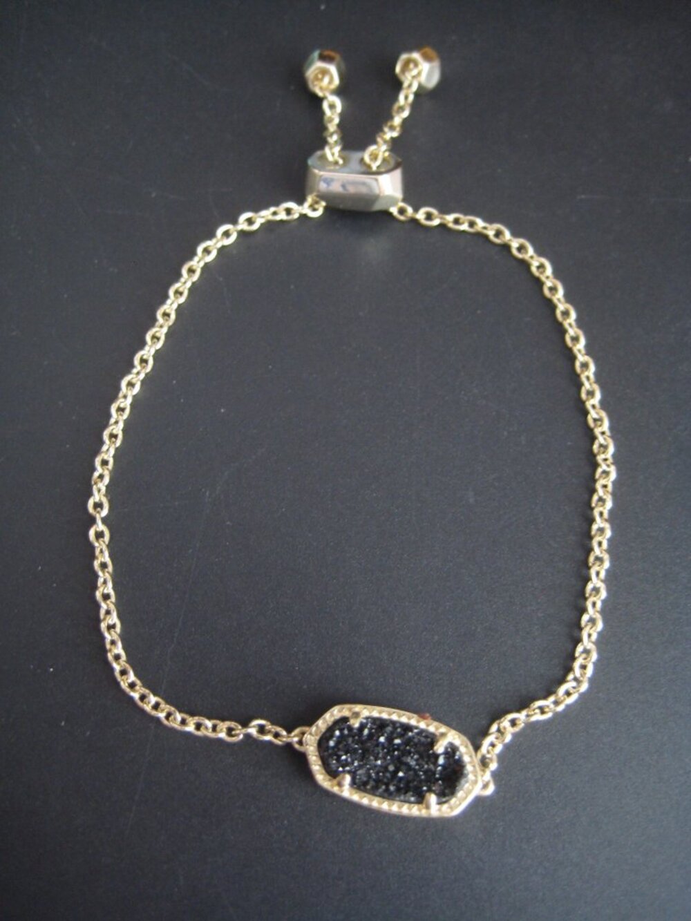 KENDRA SCOTT ADJUSTABLE GOLD PLATED BLACK DRUZY STONE BRACELET